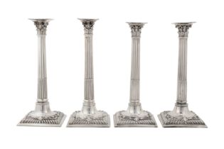 A set of four early George III sterling silver cast candlesticks, London 1762/63 by John Cafe