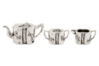 A late 19th / early 20th century Chinese export silver three-piece tea service, Canton or Shanghai c