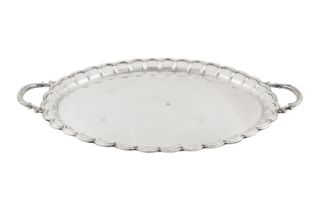 An Elizabeth II sterling silver twin handled tray, London 1973 by Garrard and Co