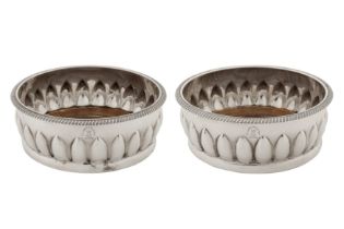 A pair of George III sterling silver wine coasters, London 1802 by Solomon Hougham