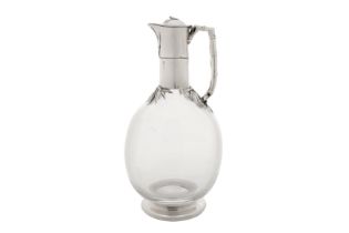 A Victorian sterling silver mounted glass claret jug, London 1883 by Edward H Stockwell