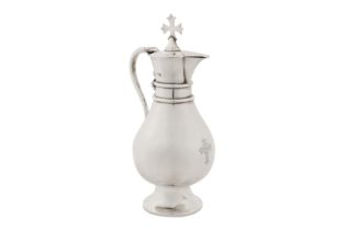 A George V sterling silver ecclesiastical wine flagon, London 1914 by J Wippell and Co Ltd