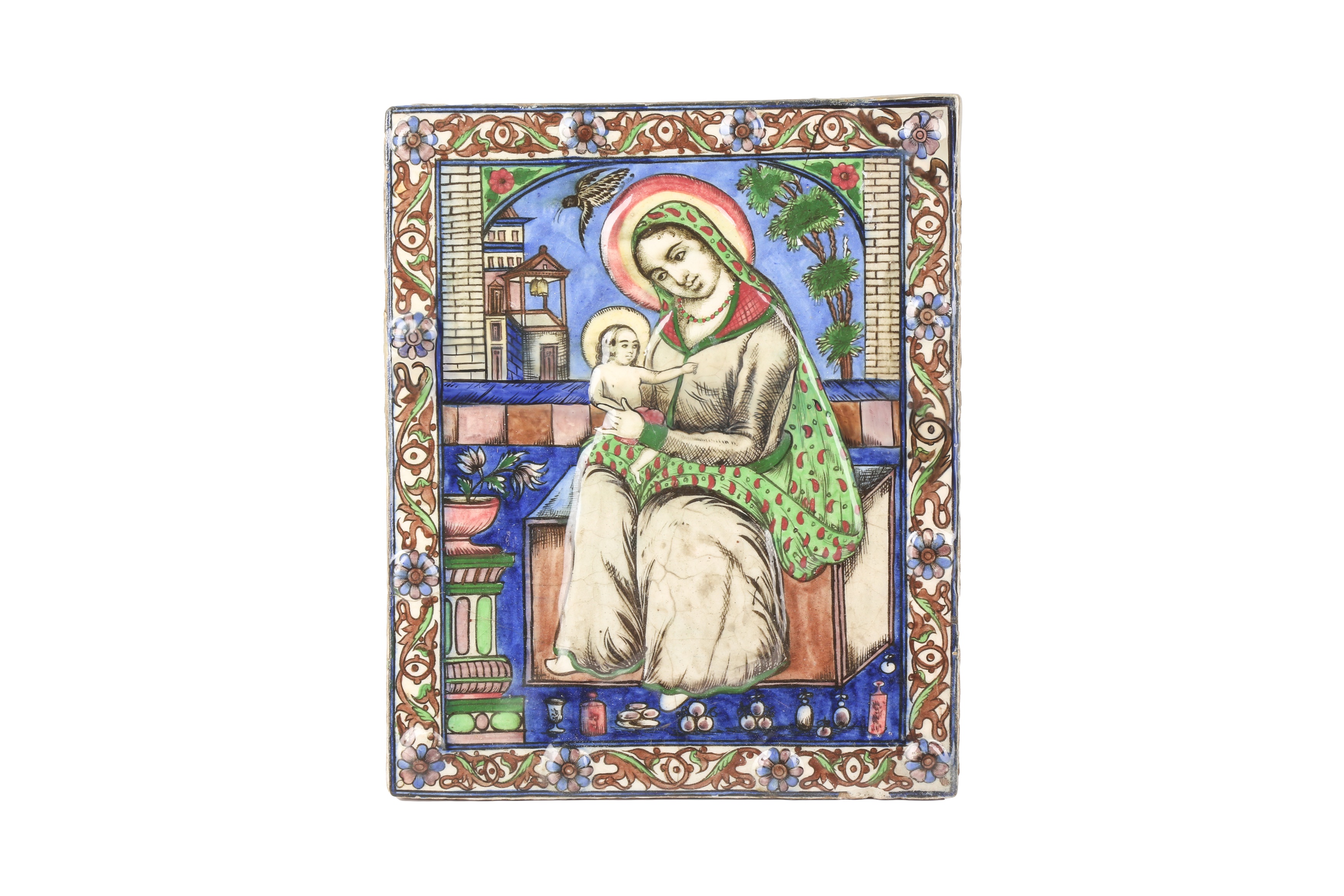 A LARGE 19TH CENTURY MOULDED PERSIAN QAJAR TILE DEPICTING MARY AND BABY JESUS