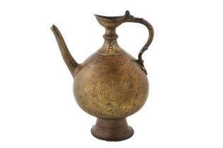 A 16TH CENTURY MUGHAL BRASS EWER WITH HANDLE
