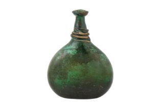 AN 18TH CENTURY PERSIAN SAFAVID GREEN GLASS SADDLE FLASK