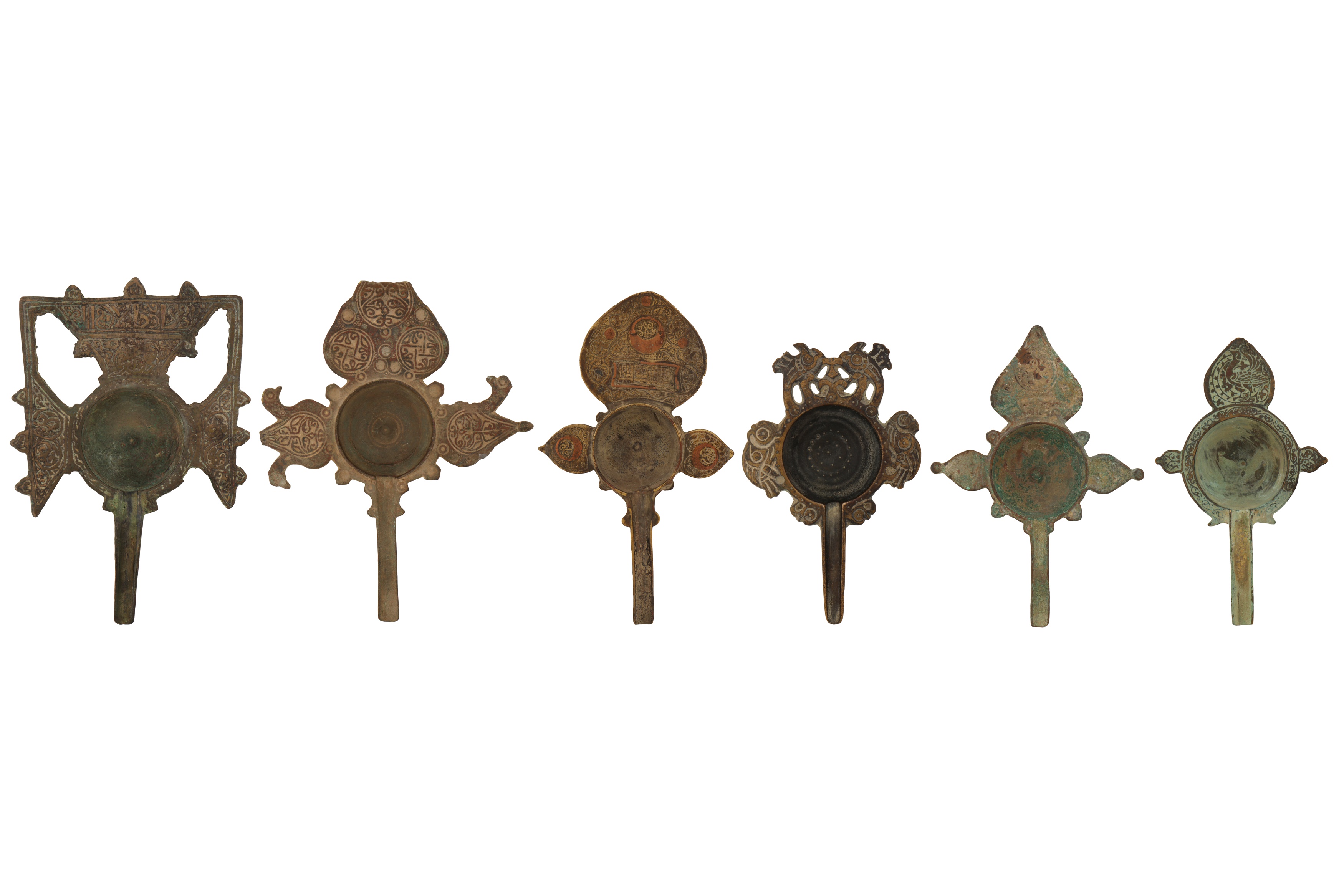 A COLLECTION OF SIX RARE 11TH-12TH CENTURY PERSIAN SELJUK BRONZE MEDICINAL POURING VESSELS