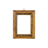 AN ITLALIAN 17TH CENTURY STYLE CARVED, GILDED AND PAINTED FRAME