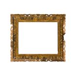 A FLORENTINE 18TH CENTURY CARVED, PIERCED AND GILDED FRAME