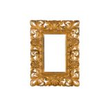 A FLORENTINE 19TH CENTURY CARVED, PIERCED, SWEPT AND GILDED FRAME