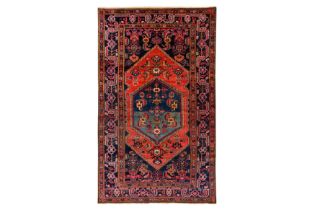 A FINE WEST PERSIAN RUG