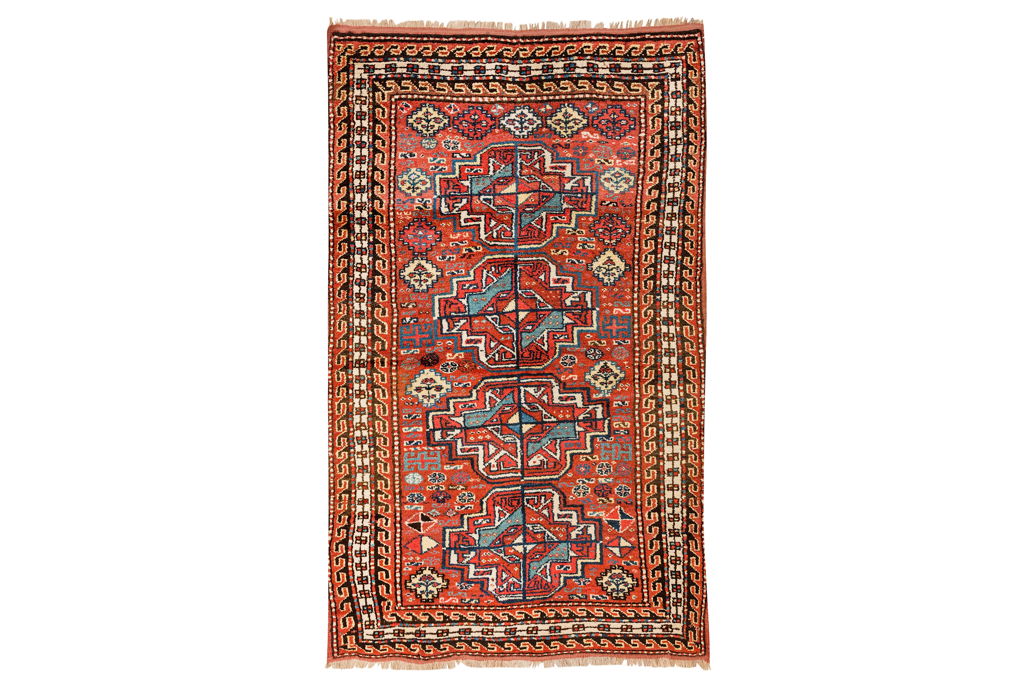 AN UNUSUAL ANTIQUE KURDISH RUG