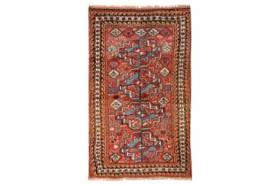 AN UNUSUAL ANTIQUE KURDISH RUG