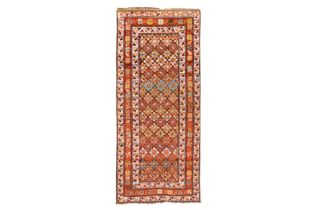 AN ANTIQUE NORTH-WEST PERSIAN LONG RUG