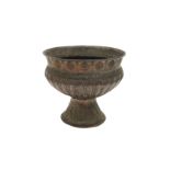 AN ENGRAVED TINNED COPPER LOBED FOOTED BASIN