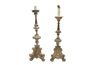 A NEAR PAIR OF ITALIAN BAROQUE STYLE SILVER PLATED ON COPPER LAMPS CONVERTED FROM CANDLESTICKS