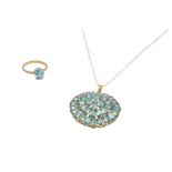 A 9CT GOLD BLUE ZIRCON PENDANT NECKLACE AND A RING