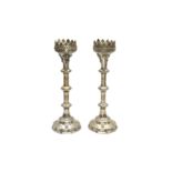 A PAIR OF 20TH CENTURY GOTHIC REVIVAL ECCLESIASTICAL SILVER PLATED PRICKET CANDLESTICKS