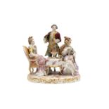 A DRESDEN PORCELAIN FIGURAL GROUP DEPICTING A TEA PARTY, LATE 19TH CENTURY