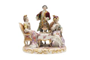 A DRESDEN PORCELAIN FIGURAL GROUP DEPICTING A TEA PARTY, LATE 19TH CENTURY