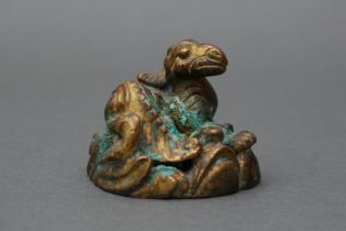 A CHINESE GILT BRONZE 'QILIN' MAT WEIGHT 十七至十八世紀 銅鎏金臥麒麟鎮紙