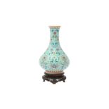 A CHINESE FAMILLE-ROSE TURQUOISE-GROUND 'LOTUS' VASE 或為清嘉慶 松石綠地粉彩纏枝番蓮紋瓶 《大清嘉慶年製》款