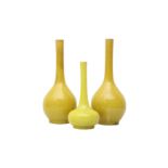 THREE JAPANESE AWAJI MONOCHROME YELLOW-GLAZED VASES