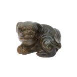 A CHINESE JADE CARVING OF A DOG 明 玉雕狗把件