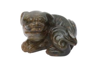 A CHINESE JADE CARVING OF A DOG 明 玉雕狗把件