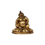 A TIBETAN GILT-BRONZE FIGURE OF VAISRAVANA 十七世紀 銅鎏金多聞天王坐像