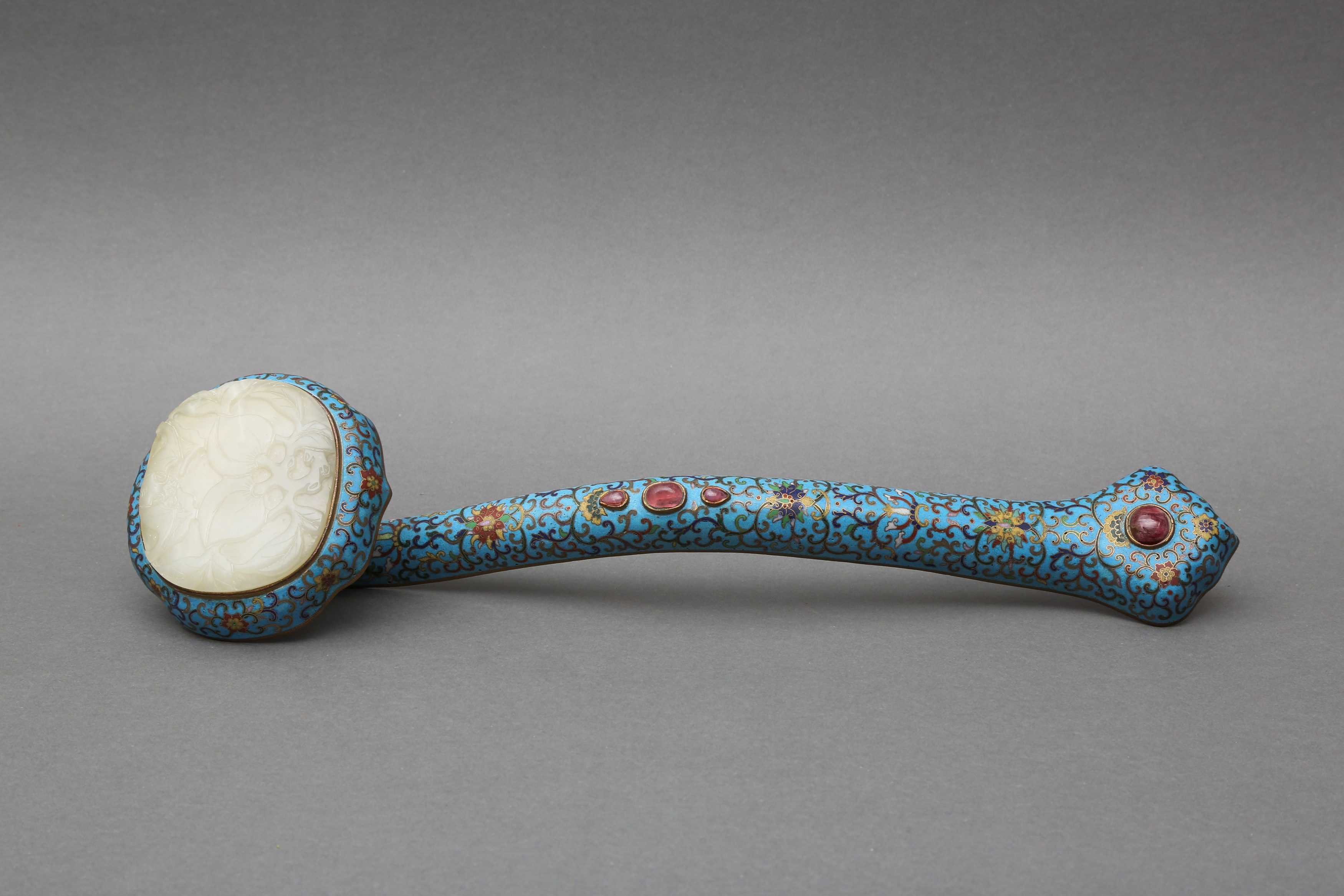 A LARGE CHINESE GILT AND CLOISONNÉ ENAMELED METAL RUYI SCEPTER WITH A WHITE JADE MOUNT 清 掐絲琺琅嵌玉如意