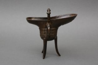 A CHINESE ARCHAISTIC BRONZE TRIPOD VESSEL, JUE 清乾隆三年（1738年）銅仿古雷紋爵 《乾隆三年仲冬吉旦處製》款