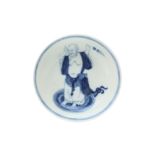 A CHINESE BLUE AND WHITE 'MONK' DISH 清康熙 青花人物圖紋盤