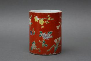 A CHINESE FAMILLE-ROSE CORAL-GROUND 'BLOSSOMS' BRUSH POT, BITONG 清十八至十九世紀 粉彩珊瑚紅地花卉紋筆筒