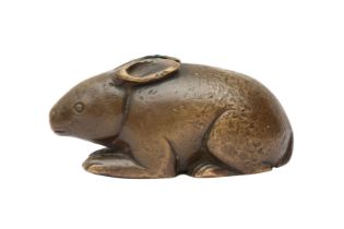 A CHINESE BRONZE 'RABBIT' SCROLL WEIGHT 明 銅兔形紙鎮