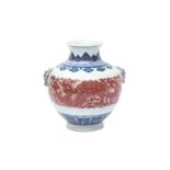 A CHINESE BLUE AND WHITE AND COPPER-RED 'DRAGON' JAR 或為乾隆 青花釉裏紅穿花龍紋雙獸耳罐 《大清乾隆年製》款