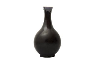 A CHINESE MONOCHROME AUBERGINE-GLAZED VASE 清十九世紀 茄皮紫釉瓶