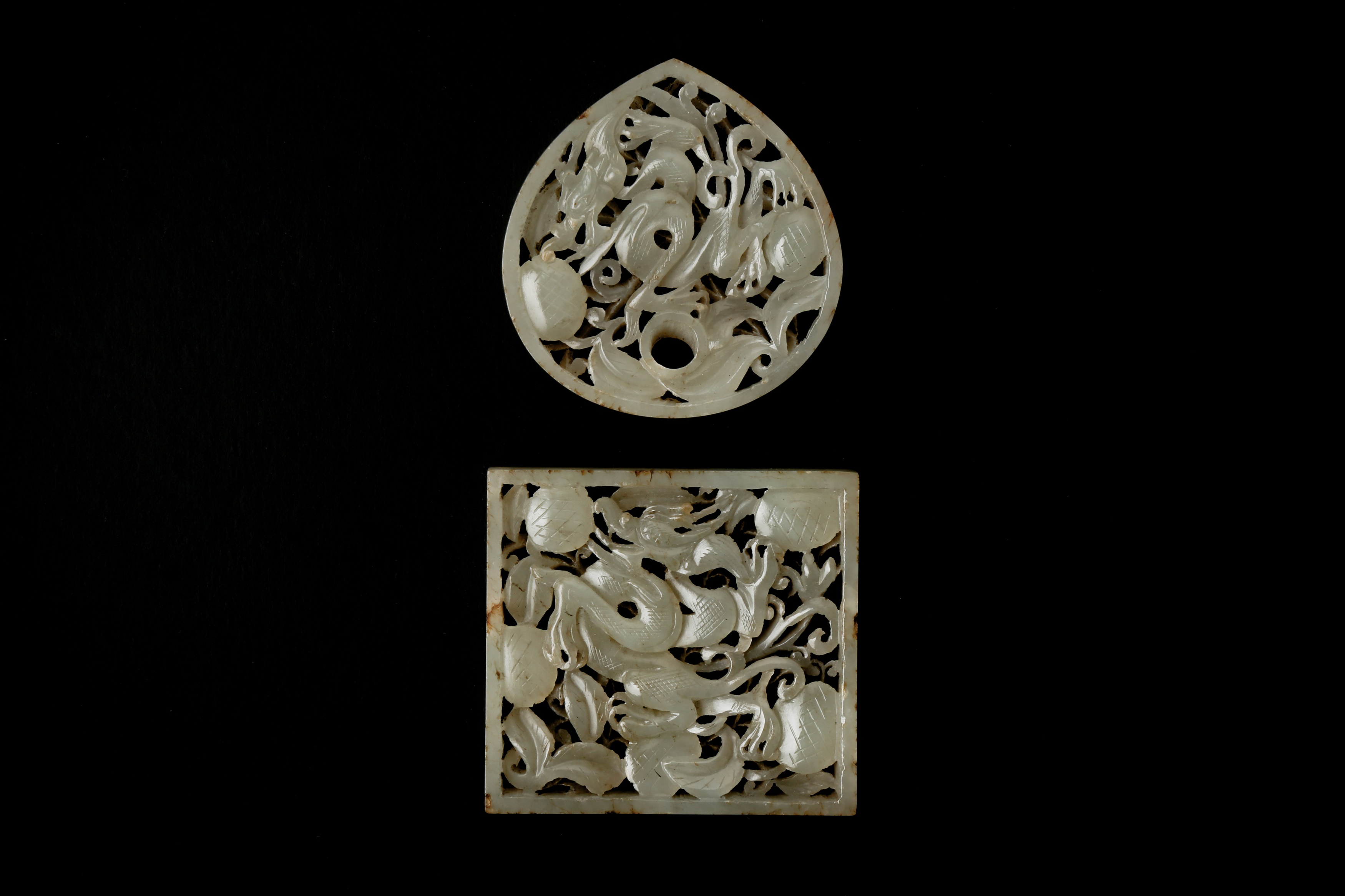 TWO CHINESE RETICULATED WHITE JADE 'DRAGON AND LYCHEES' BELT PLAQUES 元至明 白玉龍紋方形珮及荔枝紋帶板