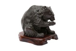 A JAPANESE BRONZE OKIMONO OF A BEAR BY GENRYUSAI SEIYA