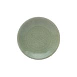 A CHINESE LONGQUAN CELADON-GLAZED 'PEONY' DISH 明十五世紀 龍泉窯青釉牡丹紋盤