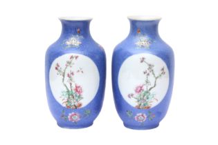 A PAIR OF CHINESE FAMILLE-ROSE BLUE-GROUND SGRAFFITO VASES 民國時期 粉彩藍地開光花卉瓶一對 《大清乾隆年製》款