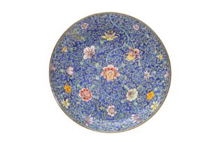 A CHINESE CANTON ENAMEL BLUE-GROUND 'BLOSSOMS' DISH 清十九世紀 廣東銅胎畫琺瑯藍地花卉紋圖盤