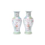 A PAIR OF CHINESE FAMILLE-ROSE VASES 清十九世紀 粉彩開光花卉紋瓶一對 《康熙年製》款