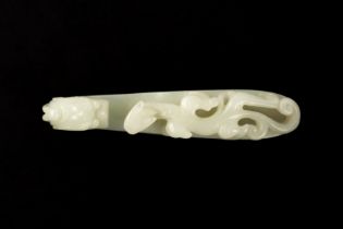 A CHINESE PALE-CELADON JADE 'DRAGON' BELT HOOK 清十八世紀 清白玉龍紋帶鉤