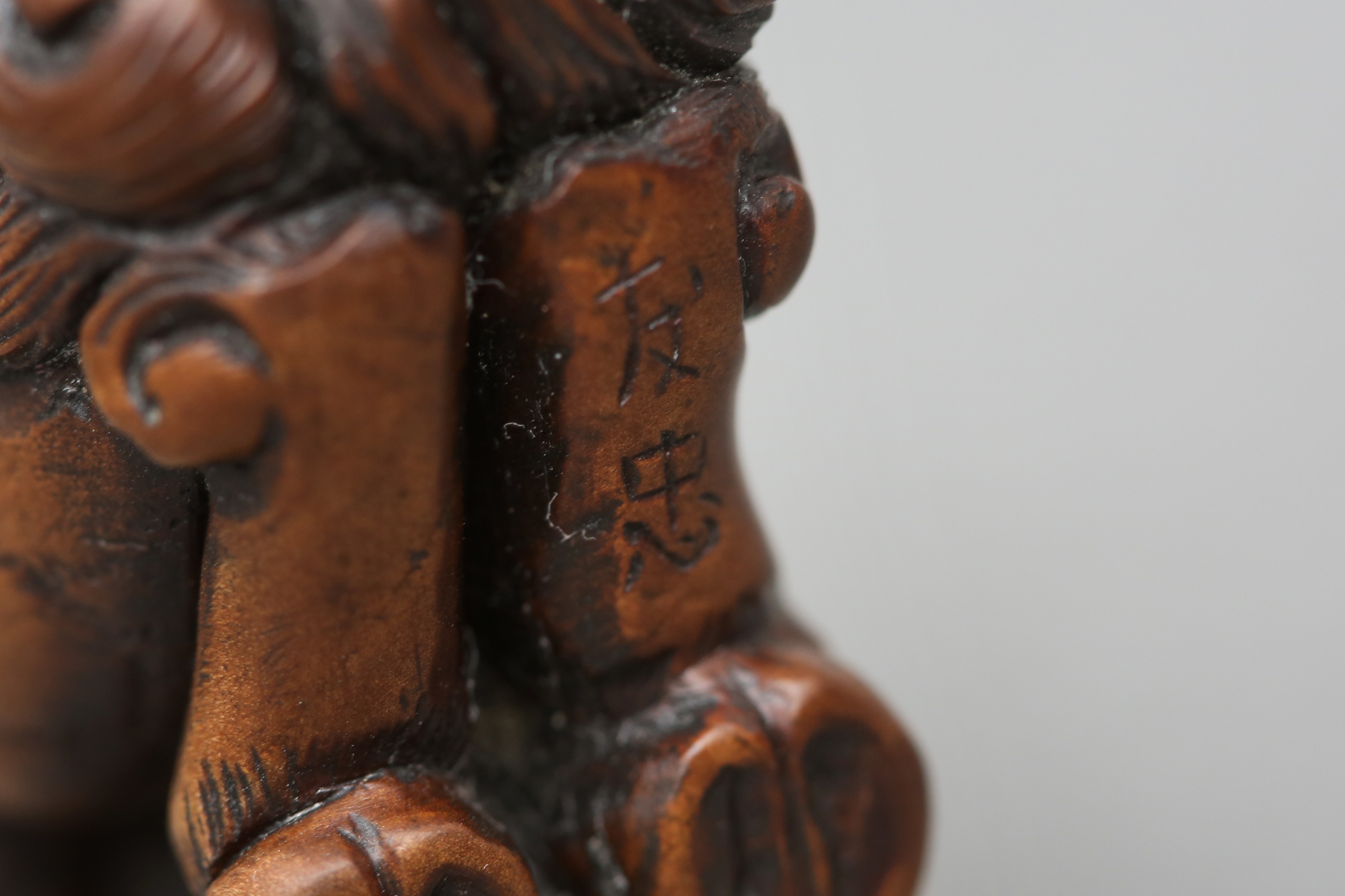 A JAPANESE BOXWOOD NETSUKE OF A MYTHICAL KIRIN, AFTER TOMOTADA - Image 3 of 3