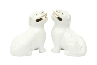 A PAIR OF CHINESE DEHUA 'LION DOG' FIGURES 十九十至二十世紀 德化白釉佛獅一對