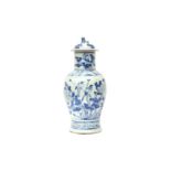 A CHINESE BLUE AND WHITE BALUSTER VASE AND COVER 清十九世紀 青花花鳥圖紋獅鈕蓋罐