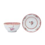 A CHINESE EXPORT FAMILLE ROSE CUP AND SAUCER 十八至十九世紀 外銷粉彩花卉紋盃及盤