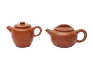 TWO CHINESE YIXING ZISHA TEAPOTS AND COVERS 二十世紀 宜興紫砂茶壺兩件