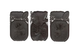 A SET OF THREE CARVED WOOD LOTUS TRAYS