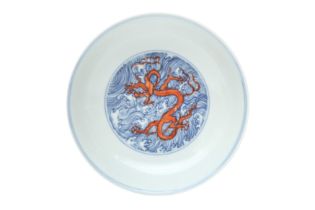 A CHINESE BLUE AND WHITE AND IRON-RED ENAMELLED 'DRAGON' DISH 二十世紀 青花矾红海水龍紋盤 《大明成化年製》款